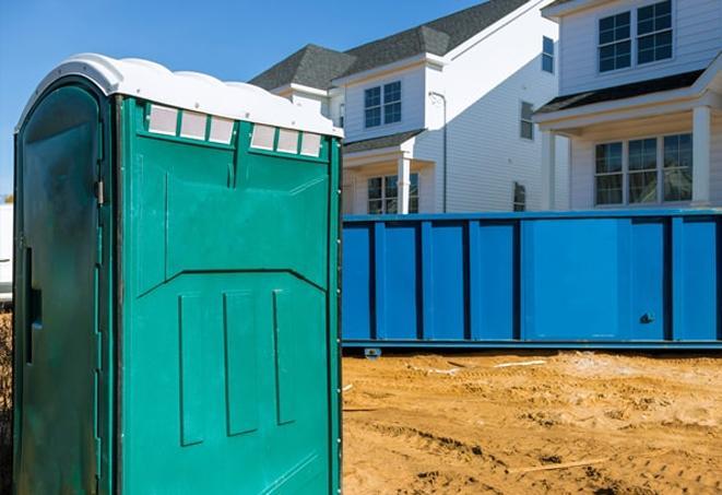 practical and convenient porta potties at a bustling job site